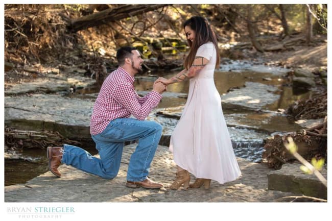 proposal in front of a creek